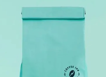 Tin tie closure on a kraft side gusset coffee bag used by specialty and artisan coffee roasters