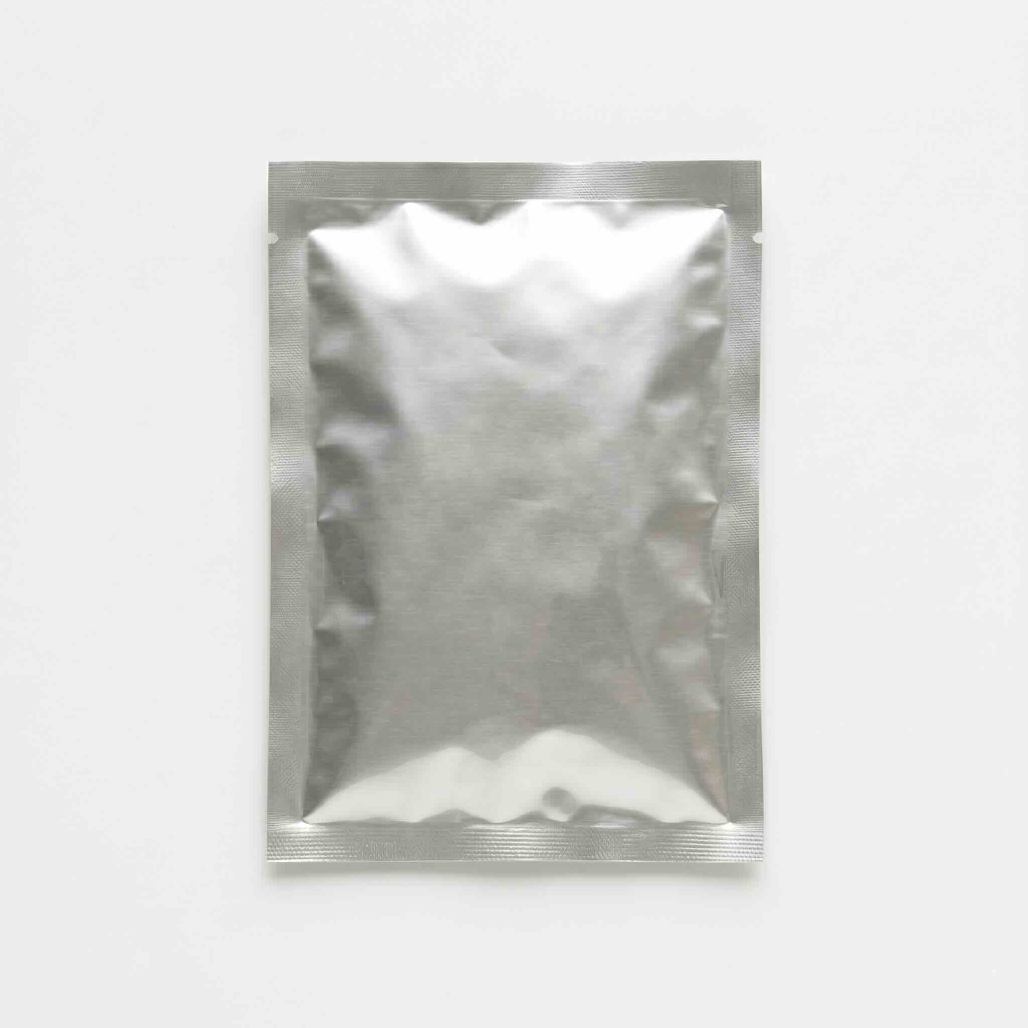 Single silver metallic mylar sachet pouch with sealed edges showing high-barrier laminate construction